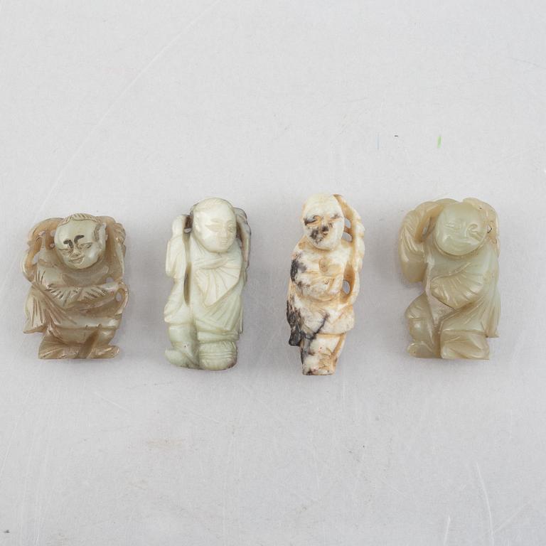 A group of four Chinese stone charms, 20th century.