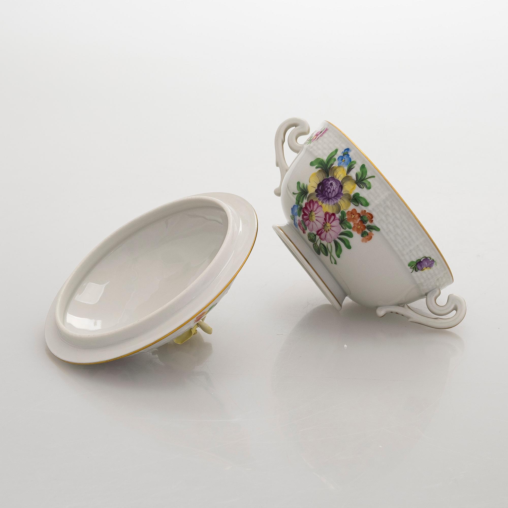 A pair of Herend porcelain candlesticks, and a lidded sugar bowl, Hungary.
