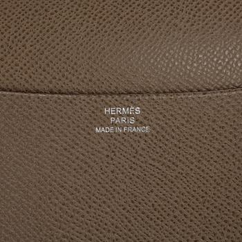 HERMÈS, a grey leather agenda cover, "Globe Trotter".