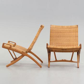 Hans J. Wegner, a pair of oak and rattan 'Folding chairs', model 512, Johannes Hansen, Denmark 1950's.