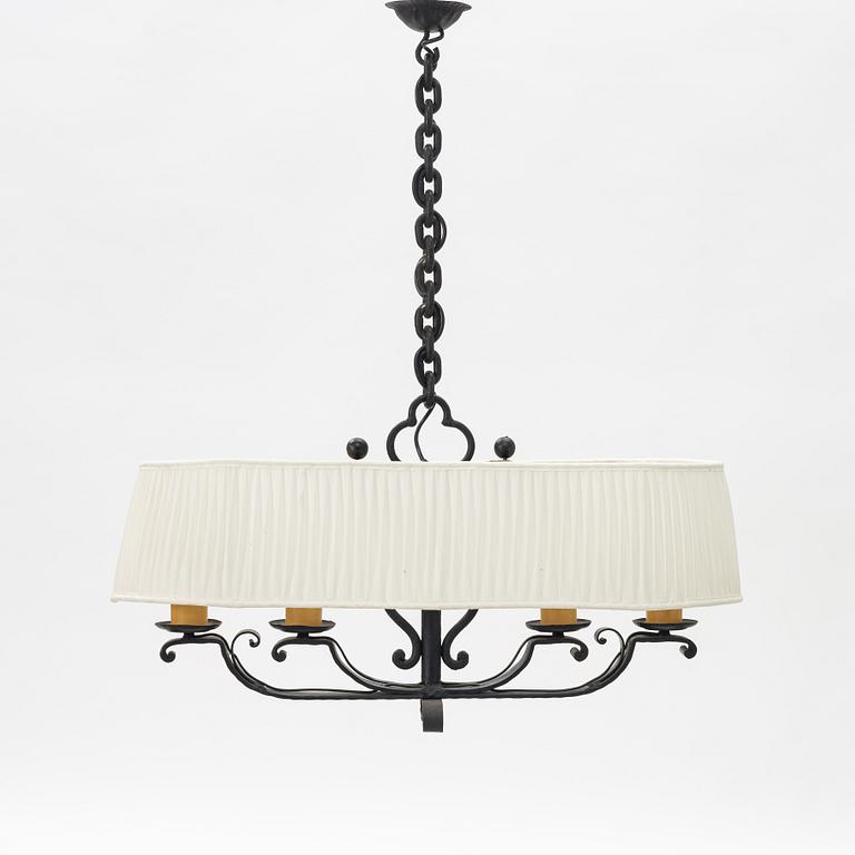 A wrought iron chalet style mid 20th C chandelier.