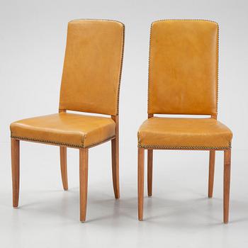 Carl Malmsten, a set of twelve, mahogany and leather chairs. Åfors Möbelfabrik.