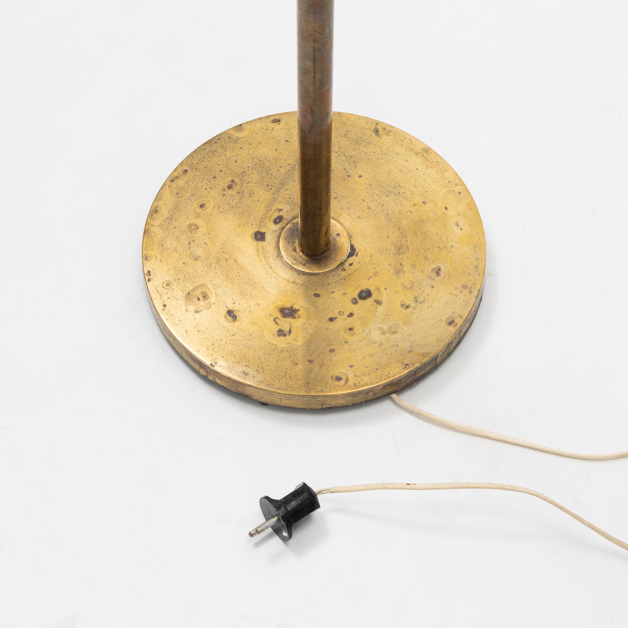 A brass floor light, seond part of the 20th Century.