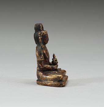 A gilt bronze Sinotibetan figure of Amitayus with a reliquary, 17/18th Century.