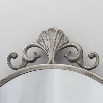 SPEGEL SAMT SPEGELLAMPETTER, tre delar, 1920-30-tal. Spegeln stämplad 1933.