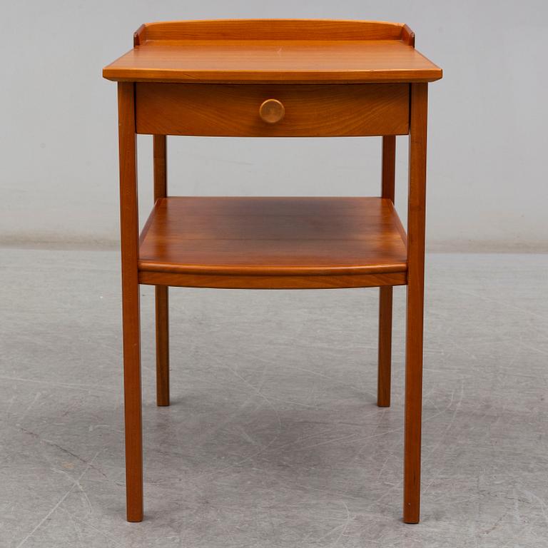 A Carl Malmsten head boards and bedside table, late 20th century.