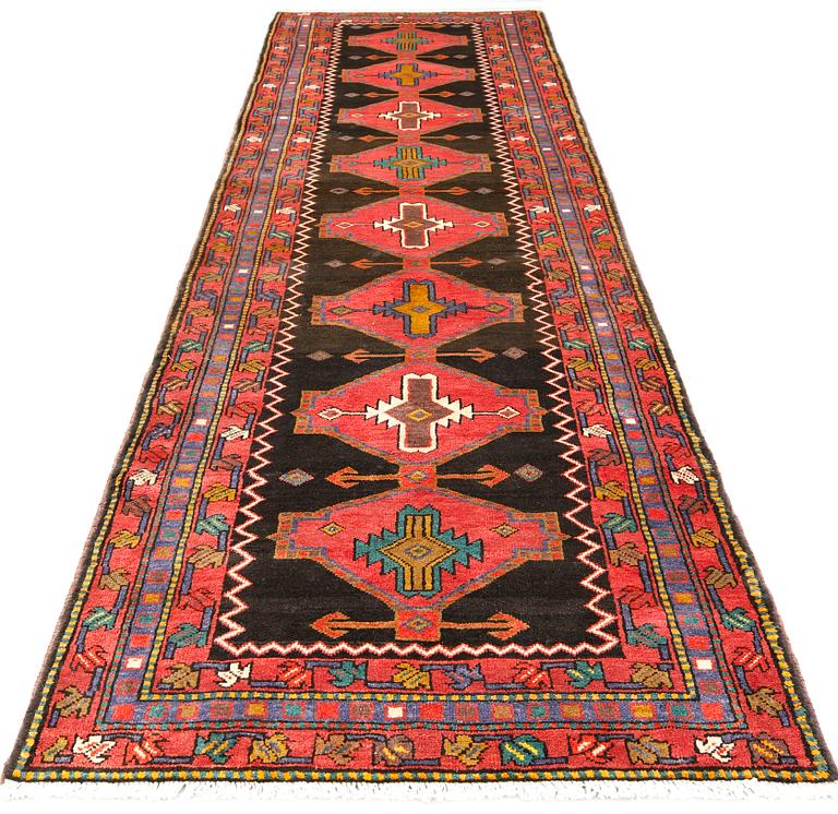 A Tabriz rug, approx. 448 x 114 cm.