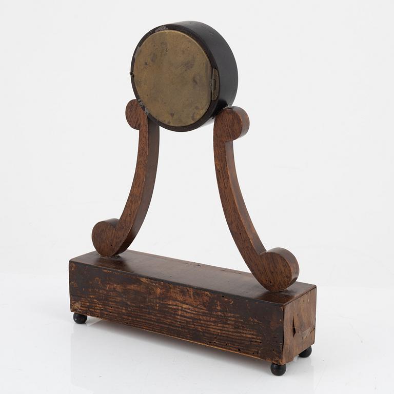 An Empire mantle clock from the 19th century.