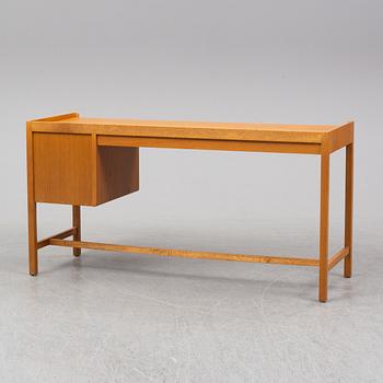 An oak veneered desk, second half of the 20th Century.