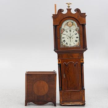 A long-case clock, England, 19th century.