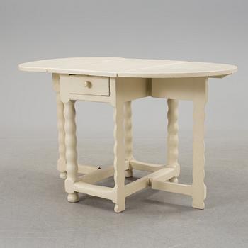 An 18th century gate leg table.