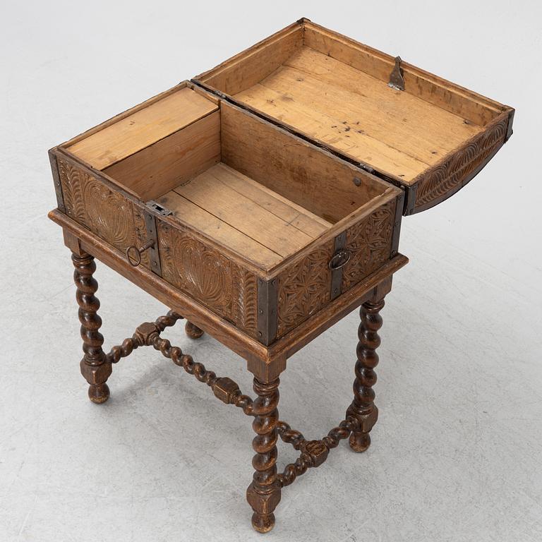A carved oak box, 19th Century.