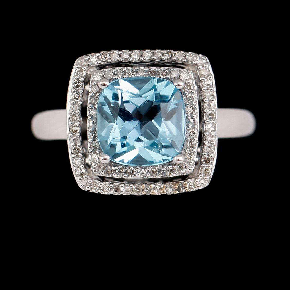 RING, 14 k vitguld, blå topas, diamanter tot ca 0.17 ct.