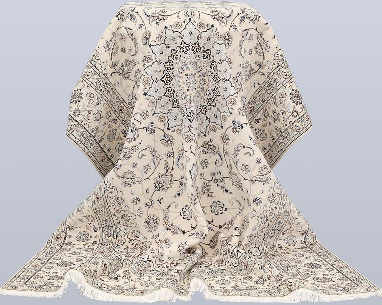 A Nain, part silk carpet, 305 x 207 cm.