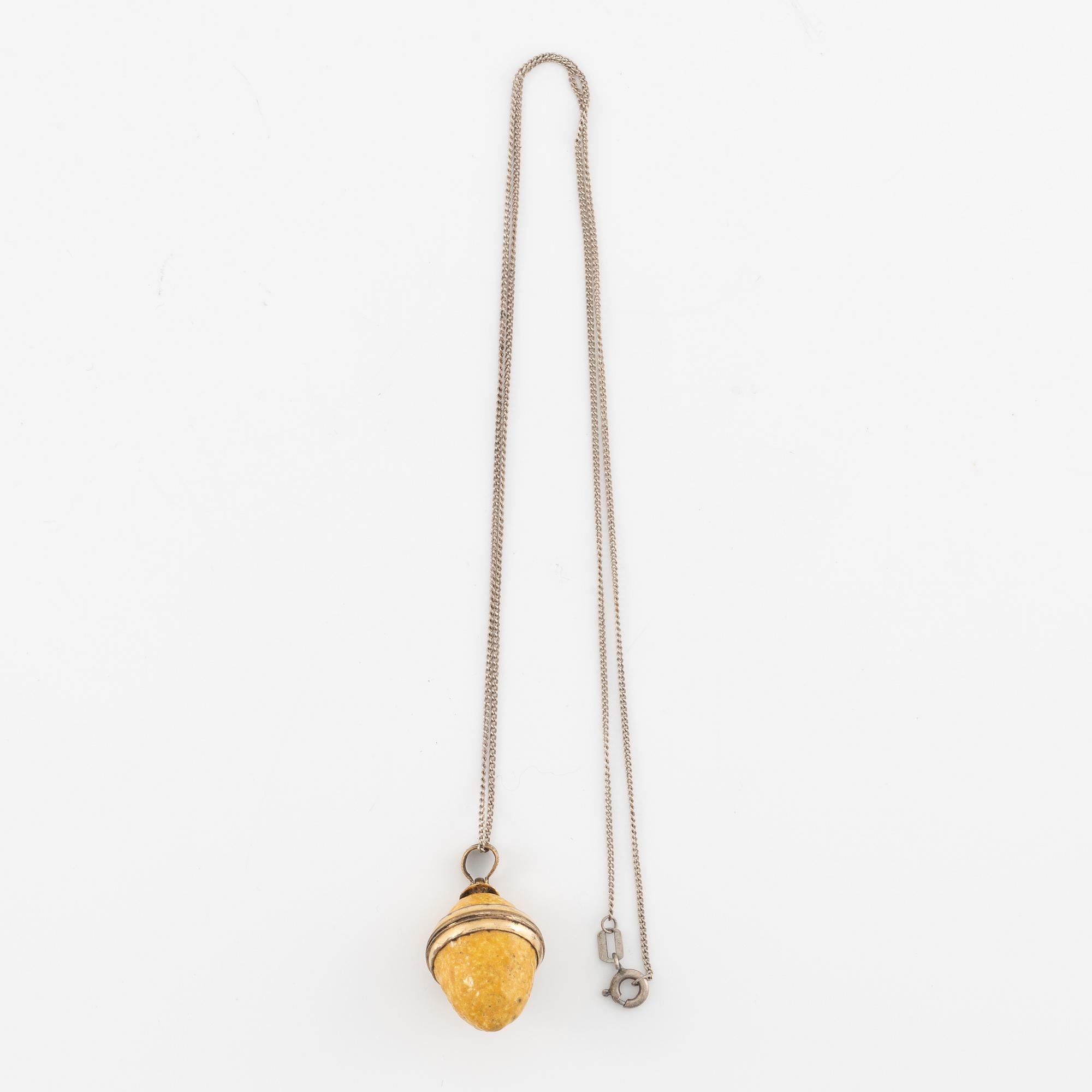 Charm in the form of a lemon with yellow enamel.