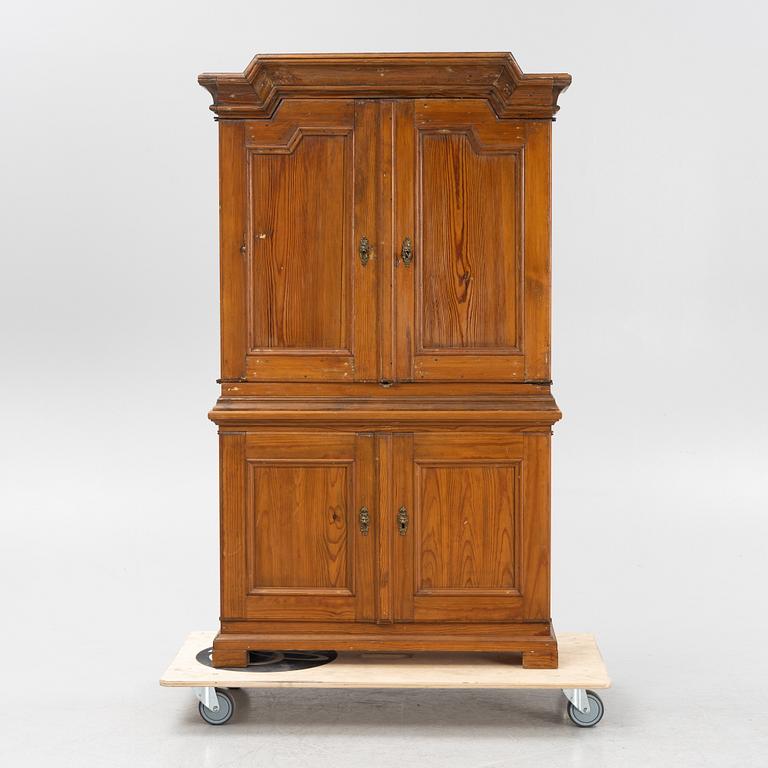 A pine cabinet, 18th Century and first half of the 20th Century.