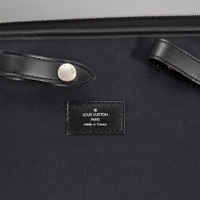 A black ardosie Leather Pégase 55 Suitcase.