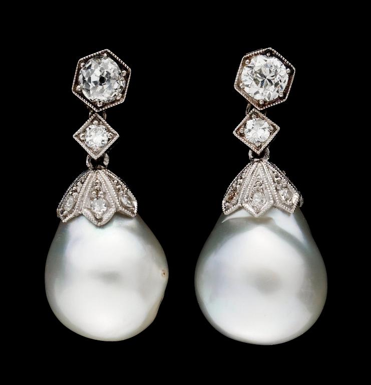 A pair of pearl and diamond earrings.