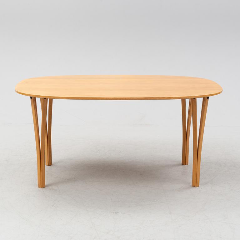 Bruno Mathsson & Piet Hein, a beech tree 'Superellips' dining table, Fritz Hansen, 1983.