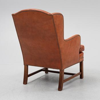 A leather upholstered easy chair, second part of the 20th Century.