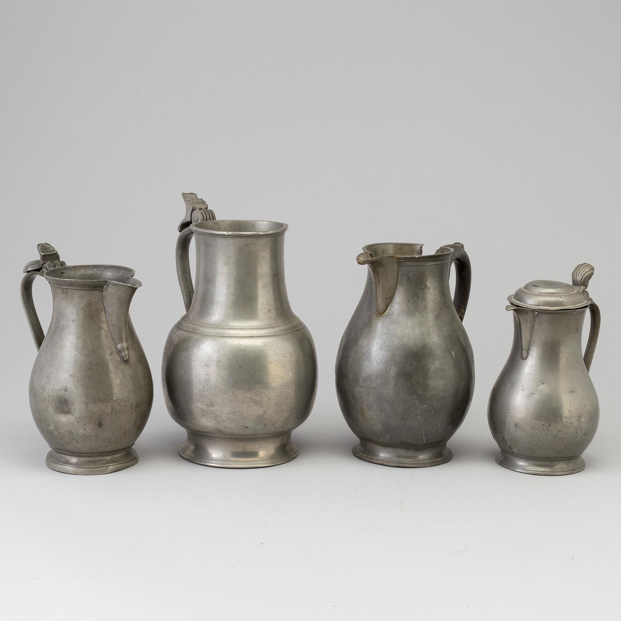 Four 18th century pewter jugs.