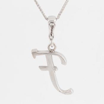 An 18K white gold pendant in the shape of letter F, with diamonds.