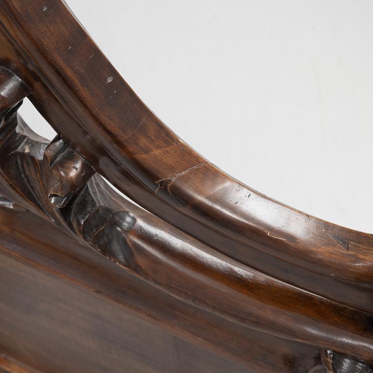 A rococo style bed frame, around 1900.