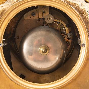 A Louis XV style table clock around 1900.