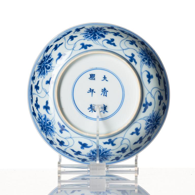 A blue and white lotus dish, Qing dynasty, Kangxi six character mark and of the period (1662-1722).