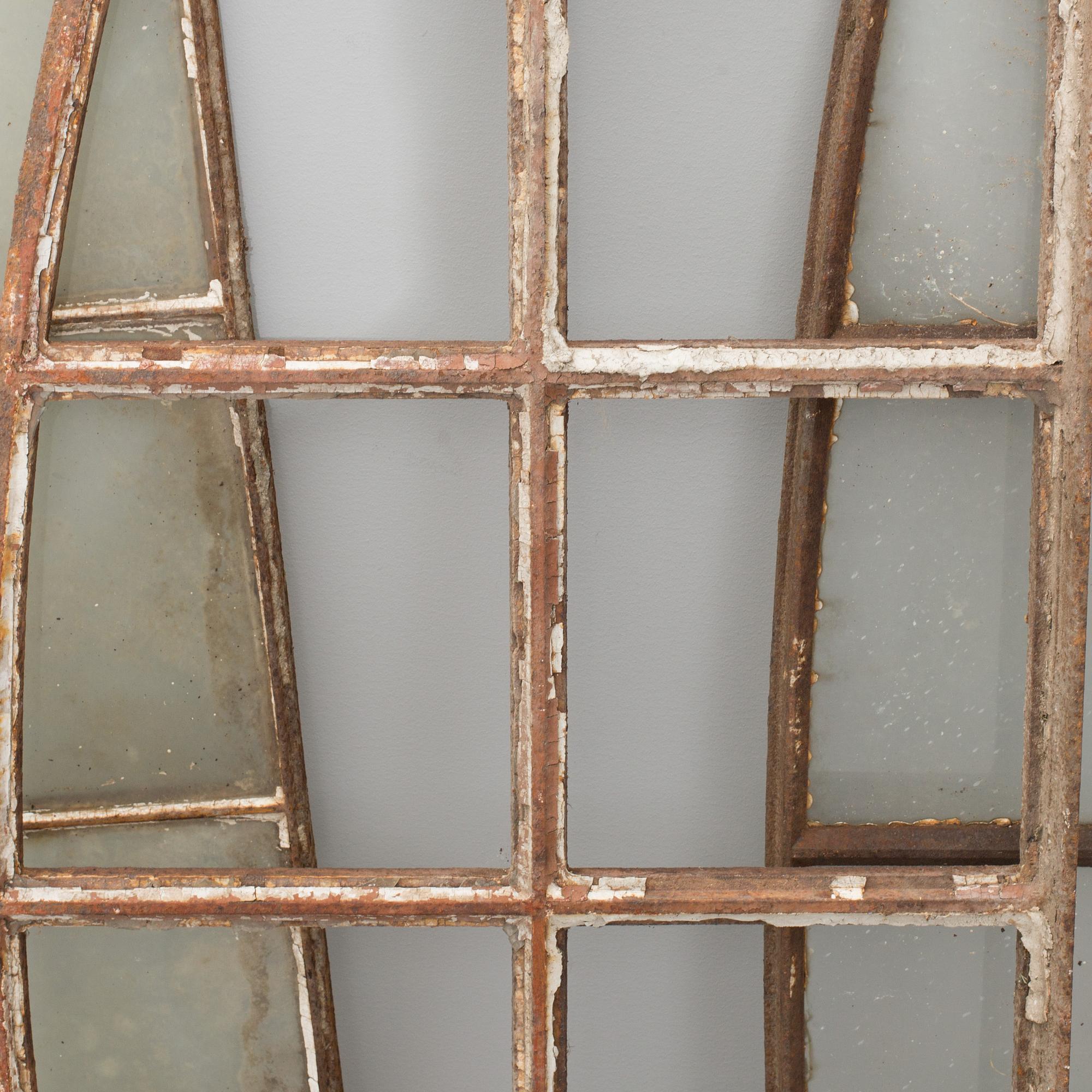 THREE CAST IRON WINDOW FRAMES, first half of the 20th century.