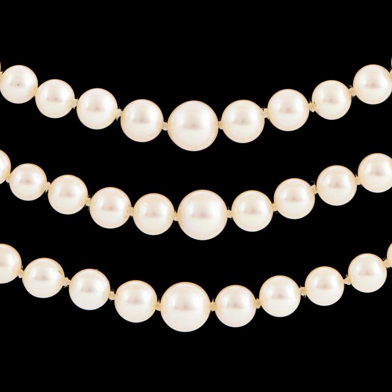 A three strand cultured pearl necklace.