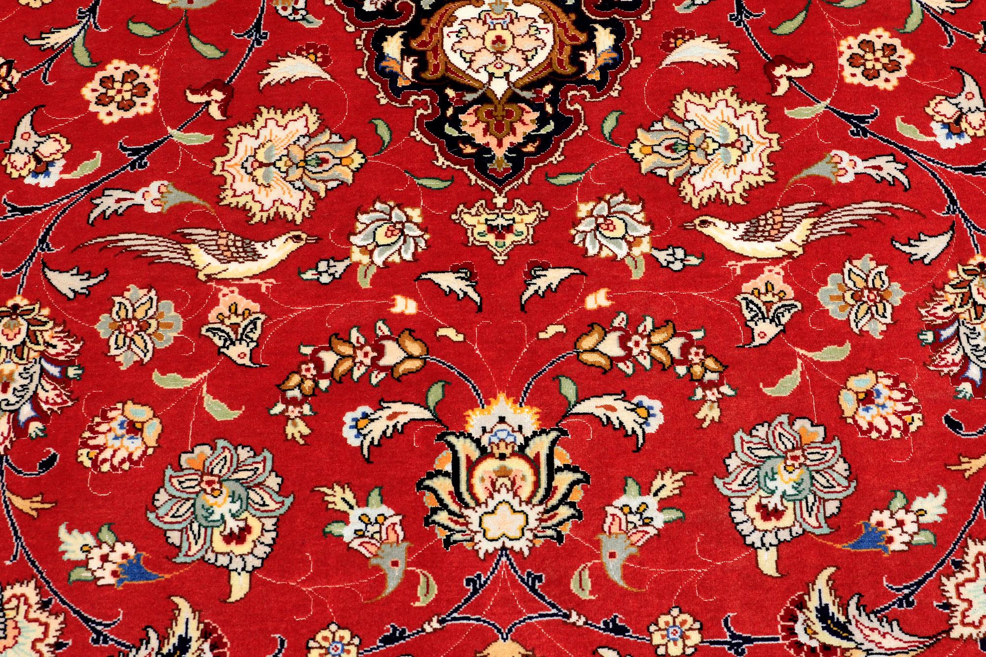 A carpet, Täbriz part silk, 341 x 248 cm.