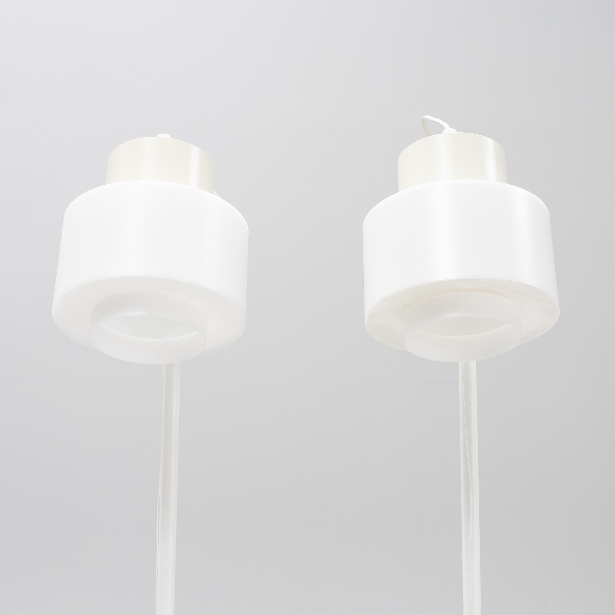 A pair of whithe floor lights, Luxus, Vittsjö.