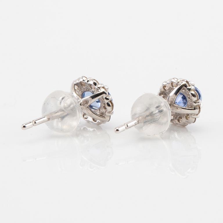 Earrings in 18K white gold with oval faceted sapphires and round brilliant-cut diamonds.