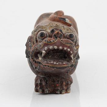 A wooden sculpture, South East Asia, 20th Century.