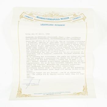 A music box in the shape of a bird's cage, France, late 19th century.