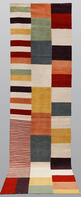 A carpet, flat weave, ca 292 x 80 cm.