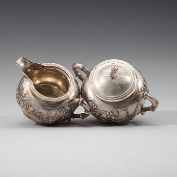 A three piece export silver tea service, Shanghai, early 20th Century.