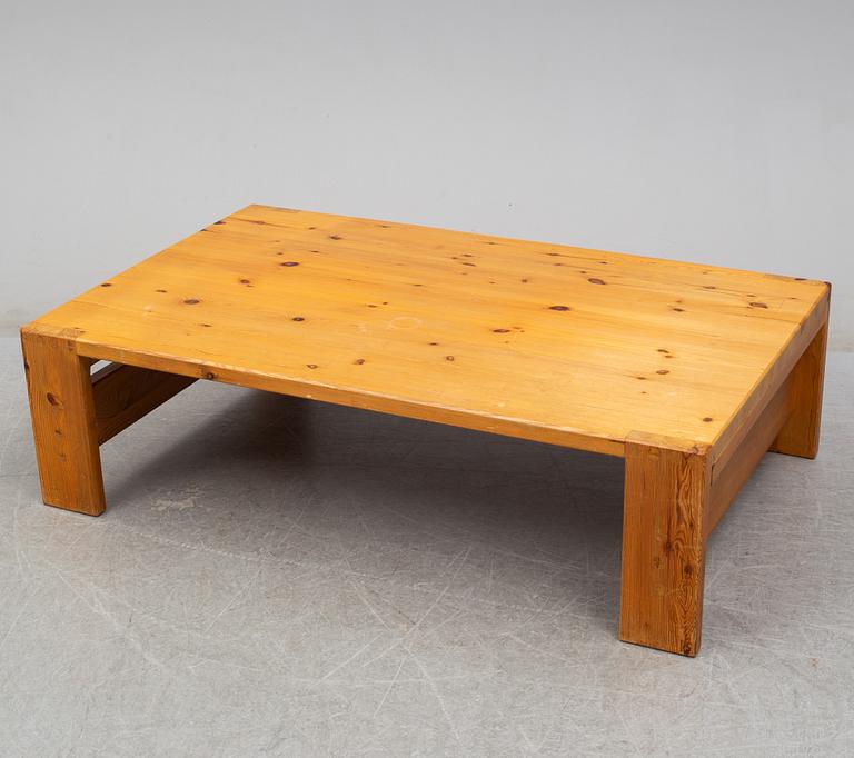 A 1960s pine coffee table.