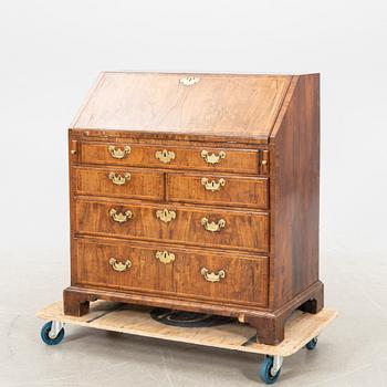 A walnut and mahogany writing bureau, mid-18th century late Baroque.