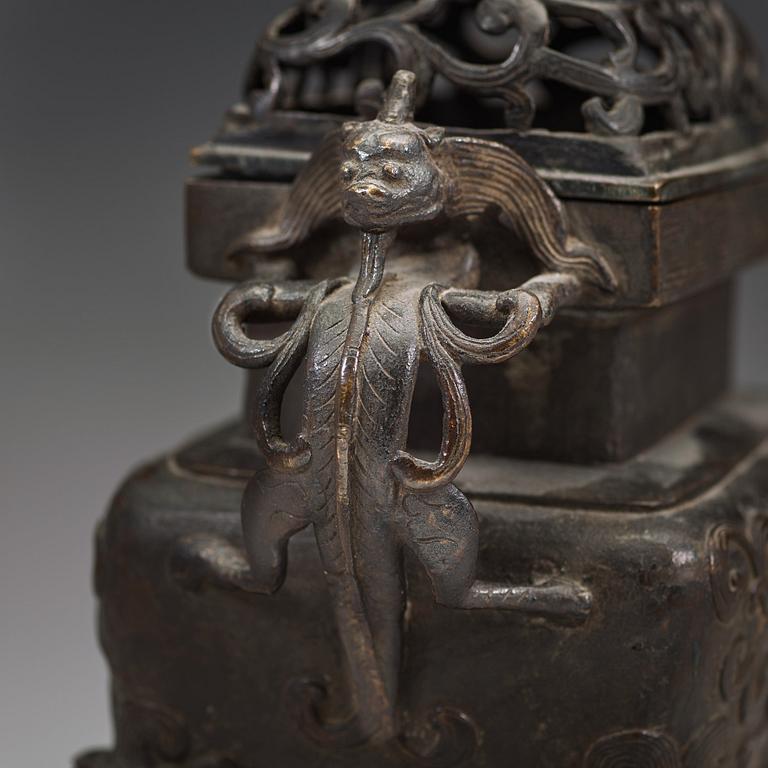 A Chinese bronze incense burner with pierced cover, Qing dynasty, 17th/18th century.