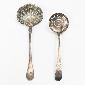 Two pierced silver bowls and two sugar spoons, including Sweden and Endland, 20th century.