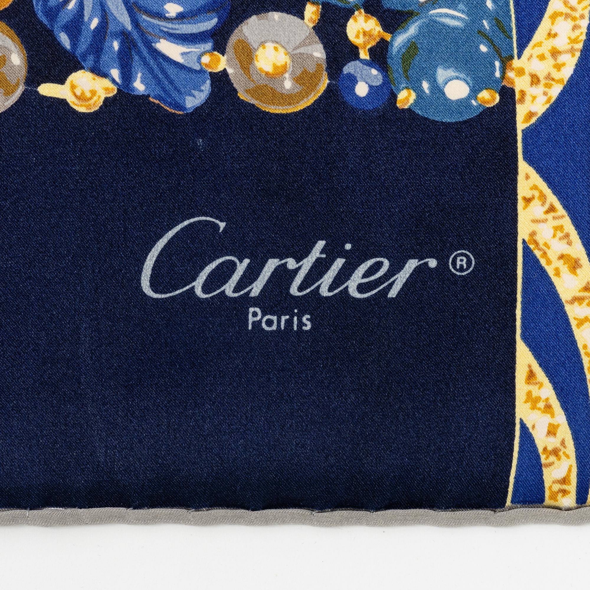 Cartier, a satin silk scarf.