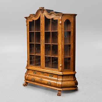 A Rococo style display cabinet, the Netherlands, circa 1900.