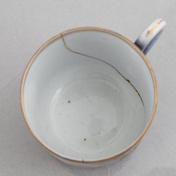 A set of nine porcelain coffee cups with saucers, Kuznetsov, Russia (1891-1917).