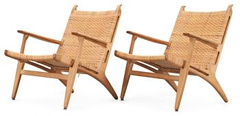 A pair of Hans J Wegner oak and rattan 'CH-27' armchairs, Carl Hansen & Søn, 1950's.