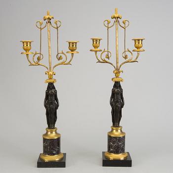 A pair of 1800s empire candelabras.