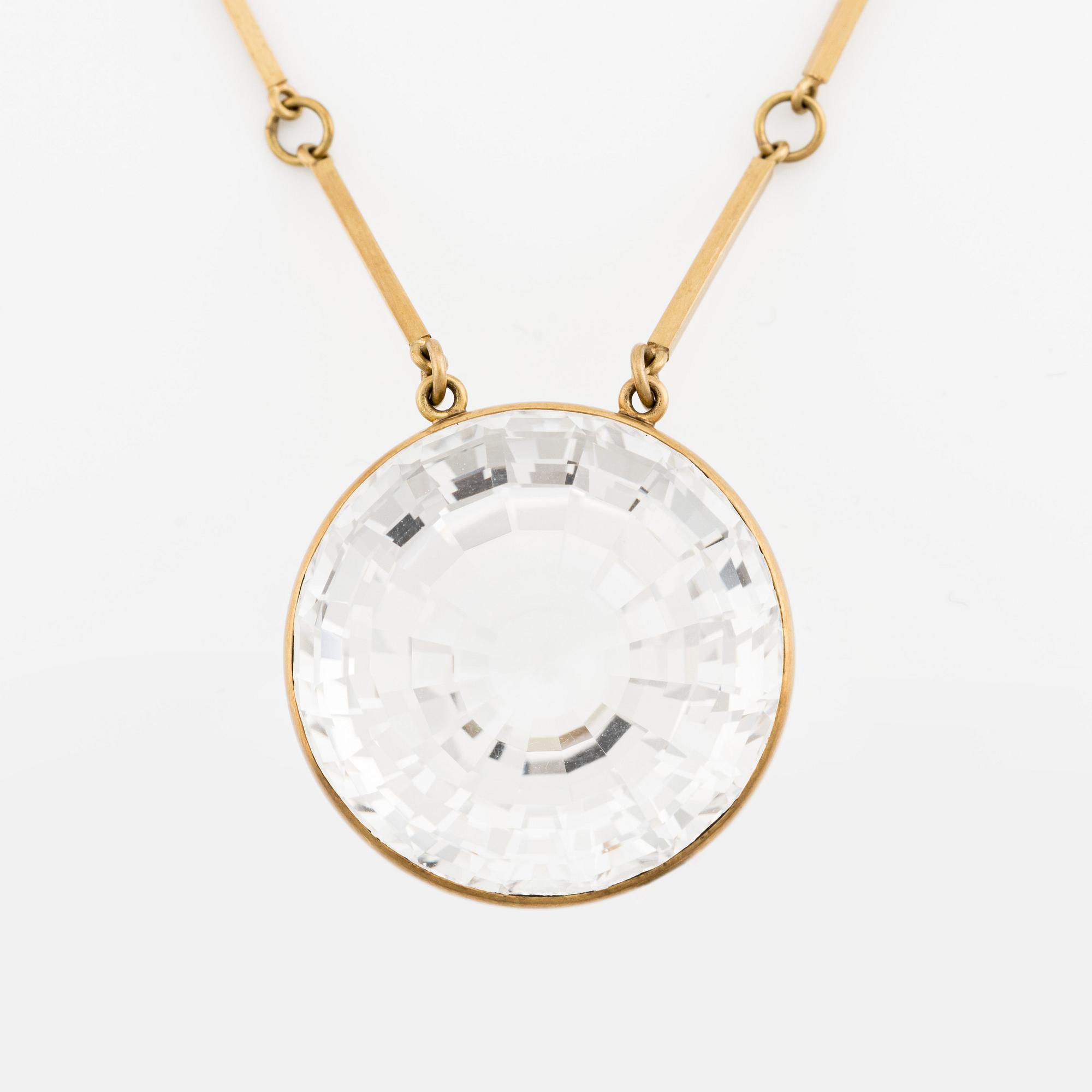 Wiwen Nilsson, an 18K gold necklace with a rock crystal pendant, Lund 1975.