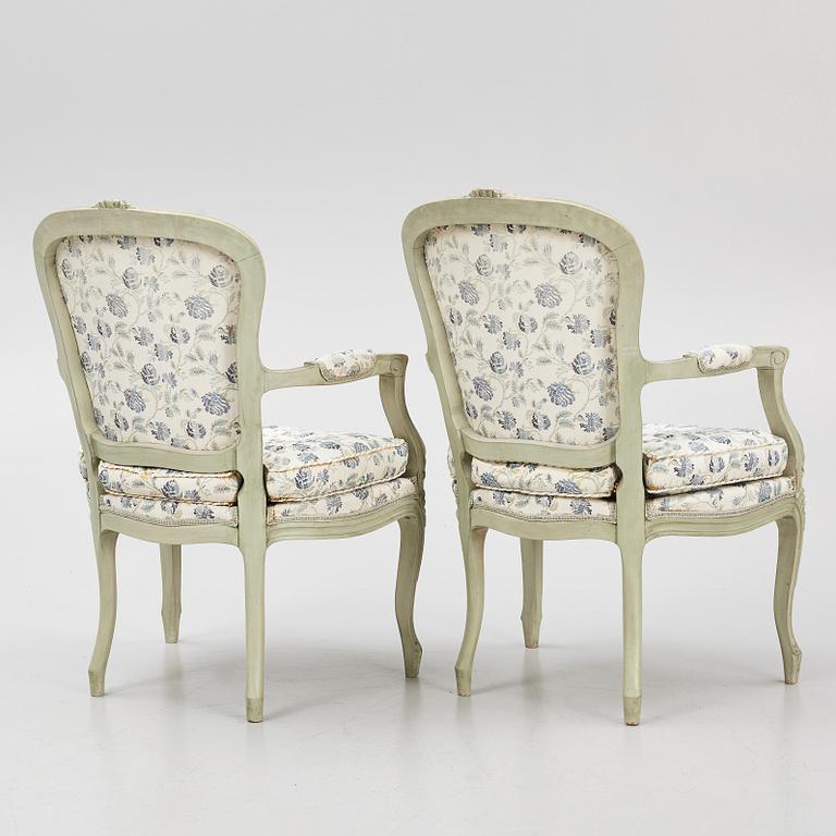 A pair of rococo-style open armchairs, 20th century.