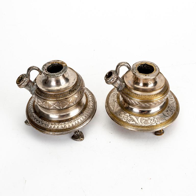 A pair of metall candle holders, India, 20th Century.